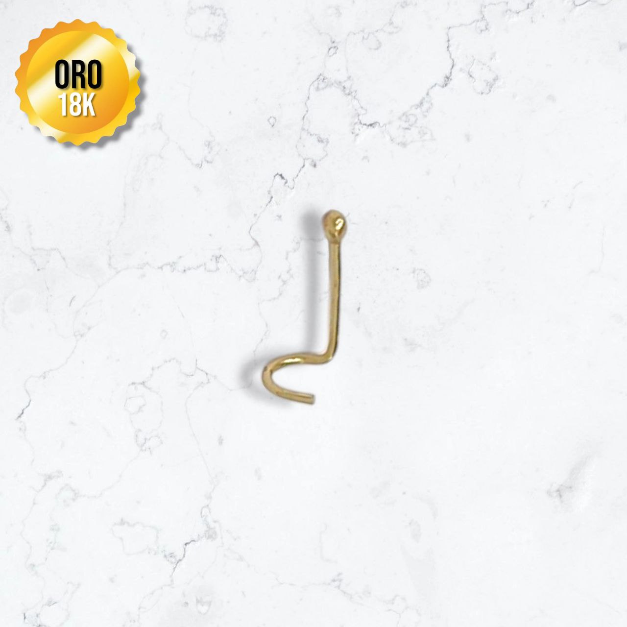 piercing en oro de 18K color dorado en forma de chispa con punta redondeada