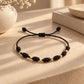 PULSERA 7 NUDOS BALINES ORO 18K HILO NEGRO