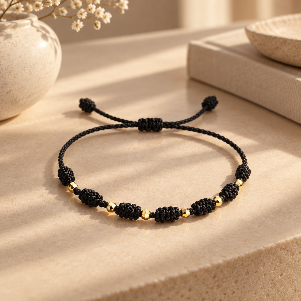 PULSERA 7 NUDOS BALINES ORO 18K HILO NEGRO