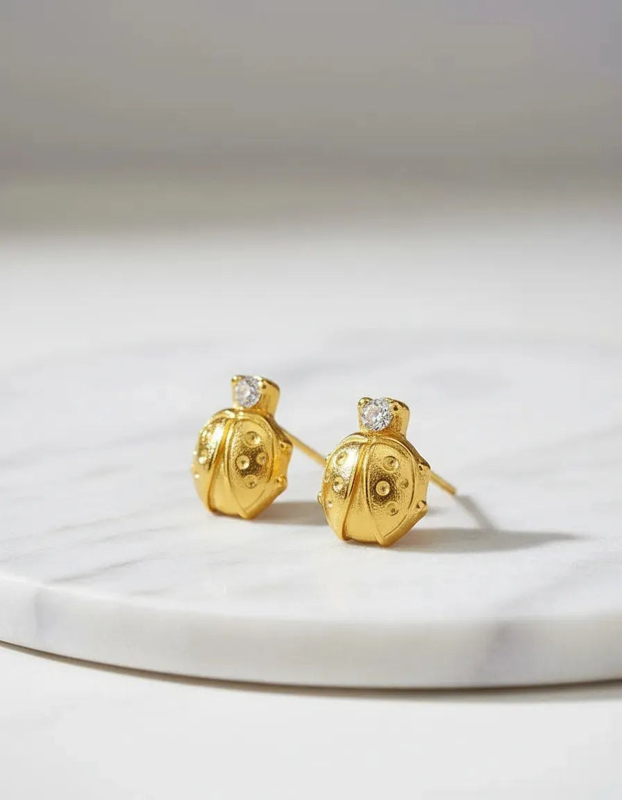 Aretes Anti alérgicos Mariquitas Oro Laminado18k