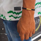 Pulsera oro 18K textura diamantada unisex hilo negro
