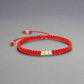 Pulsera de oro 18K tejida con hilo rojo y balines de 3 mm hecha a mano villavicencio colombia