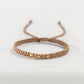 Pulsera tejida en beige con 3 balines de oro 18k - Brillo Encanto